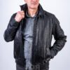 Мъжкото яке от естествена кожа VK- E 223 ще ви помогне да създадете своя ненадминат уникален стил. Един от най-популярните модели мъжки якета от естествена кожа. Подобни модели с различни дизайнерски опции са включени във всяка нова колекция. Късо кожено яке в стил бомбър. Кожен ластик на ханша  и маншетите. Затваряне с цип. В предната част има два джоба. Якето се характеризира с повишена устойчивост на износване, практичност и перфектно запазва външния си вид в продължение на много сезони. Много удобен, атрактивен модел ушит от висококачествена естествена релефна агнешка кожа. Тя е мека и еластична, има характерен приятен блясък. Издръжлива, без мирис, лесна за почистване. Подвижната яка на продукта е стригана овча кожа. Това е надежден материал, който запазва топлината добре. Овчата вълна е приятна на допир и хипоалергенна. Яката тип риза внася класика и собствена „жизненост“ във визията. Но при ветровито време може да се повдигне за по-голям комфорт.